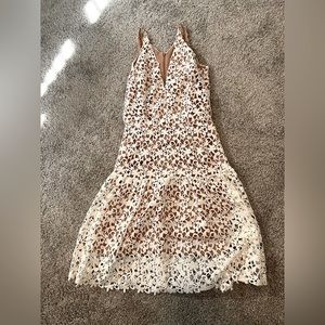 Dress the population size medium dress with white lace overlay.